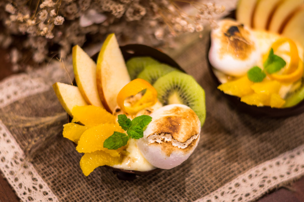 Bowl of chocolate with cream and fruit